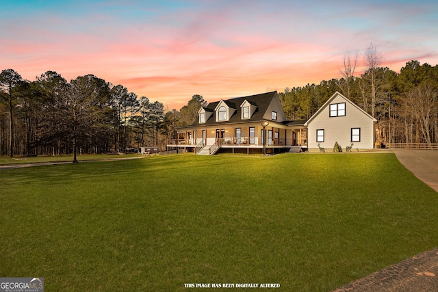 exterior space featuring a lawn and a porch