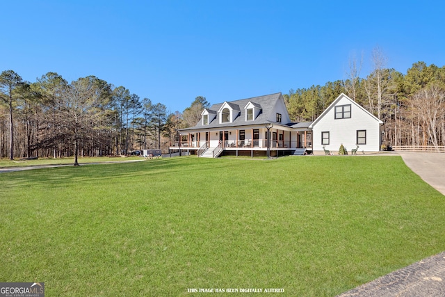 view of front of house with covered porch and a front lawn