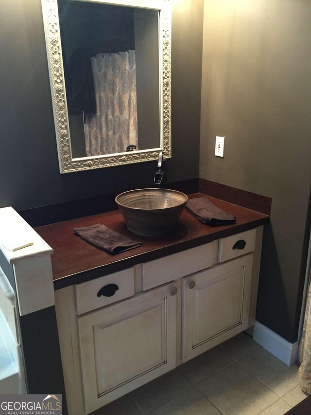 bathroom featuring tile patterned floors and vanity