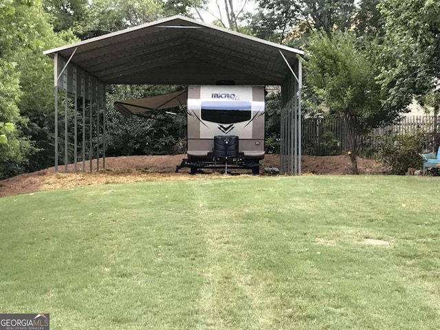 view of parking with a carport and a lawn