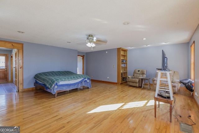 bedroom featuring ceiling fan and light hardwood / wood-style floors