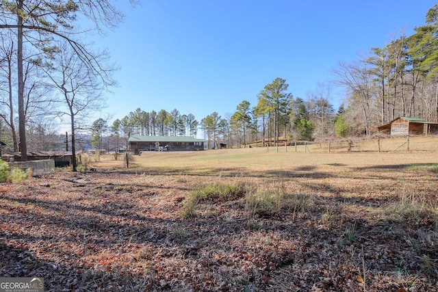 view of yard with a rural view