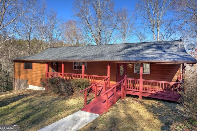 ranch-style house with a front lawn and covered porch