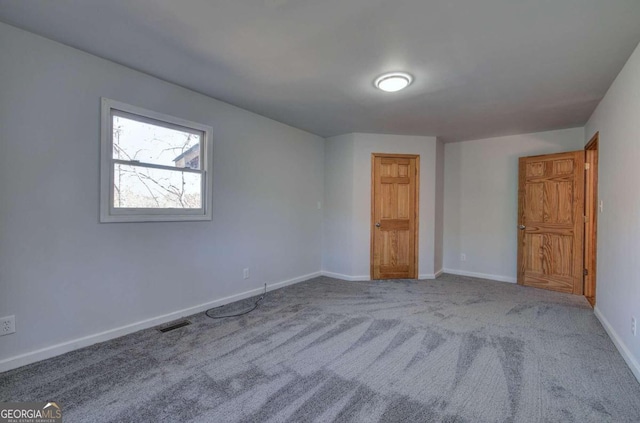 unfurnished bedroom featuring carpet