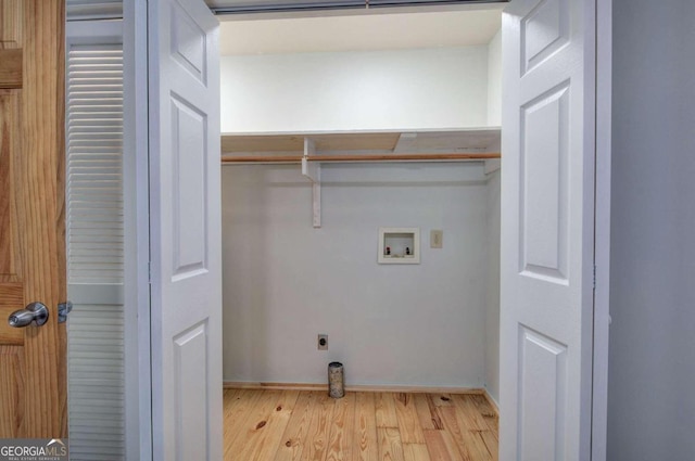 laundry area with light hardwood / wood-style floors, electric dryer hookup, and washer hookup