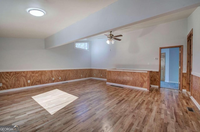 spare room with ceiling fan and hardwood / wood-style flooring