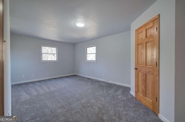 spare room with carpet flooring