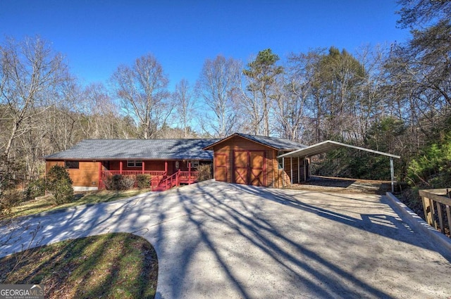 ranch-style house with a carport