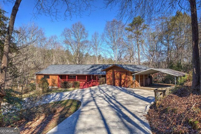 single story home with a carport