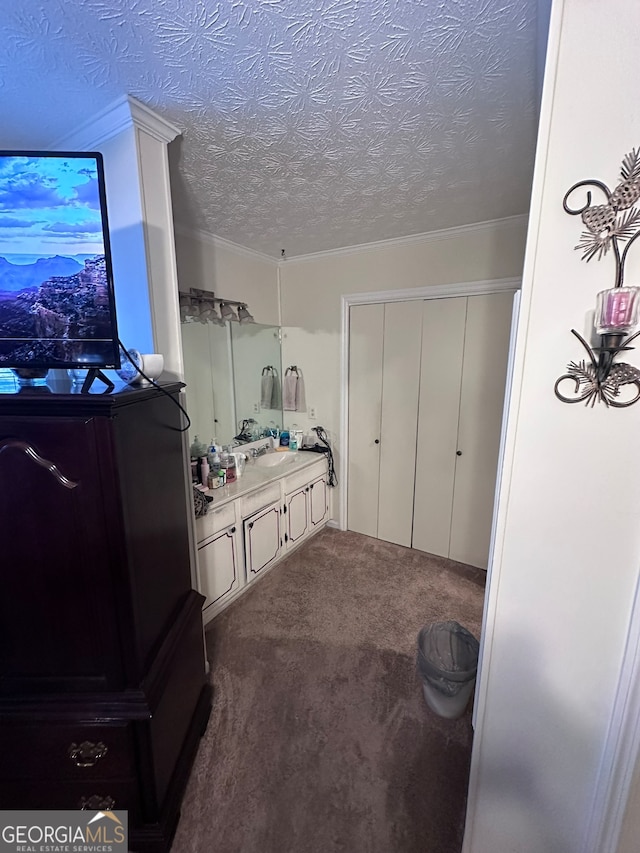 bathroom featuring a textured ceiling and sink