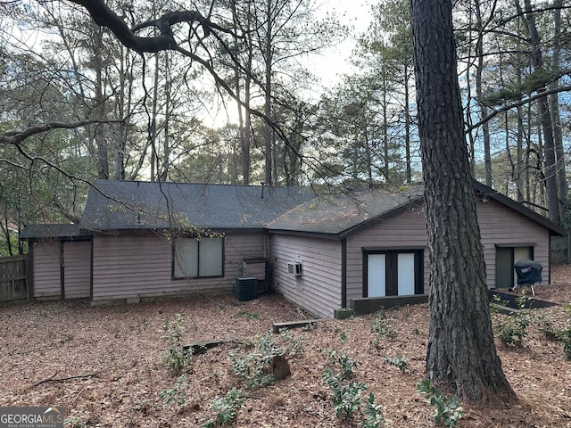 rear view of house with central air condition unit