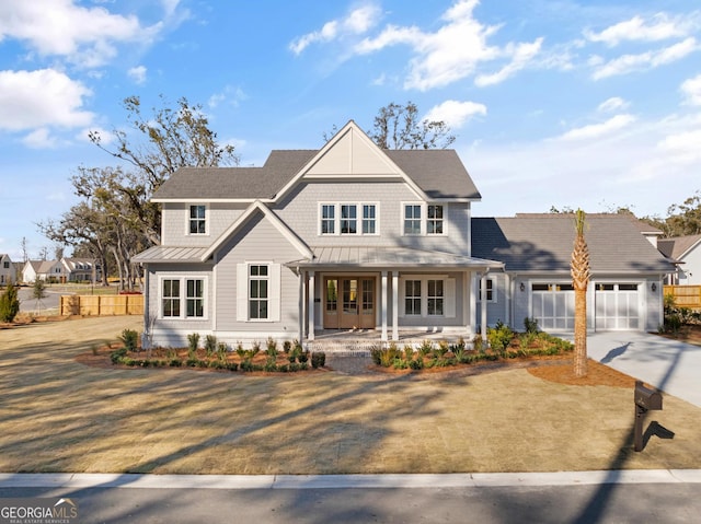 view of front of house featuring a porch and a garage