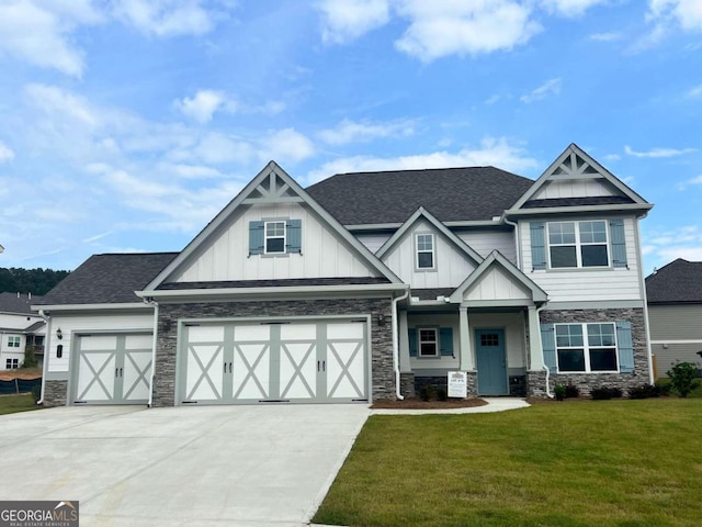 craftsman-style house with a front lawn and a garage