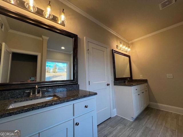 bathroom featuring double vanity and ornamental molding