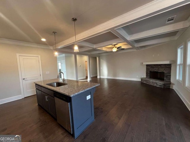 kitchen with ceiling fan, a fireplace, sink, dark hardwood / wood-style flooring, and pendant lighting