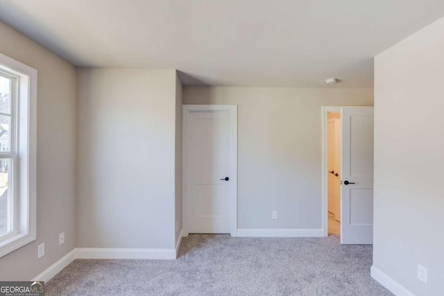 empty room with light colored carpet