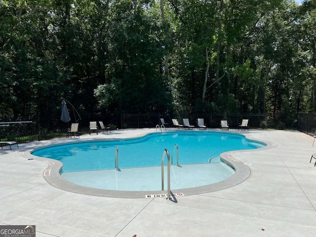 view of swimming pool featuring a patio