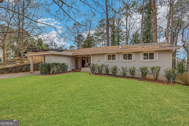 ranch-style home with a front lawn