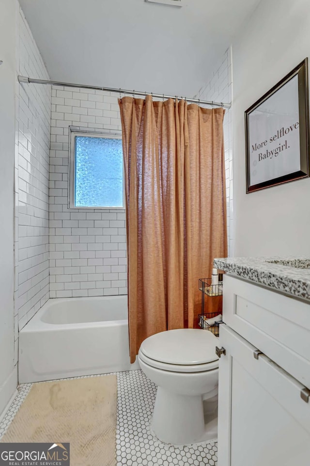 full bathroom featuring shower / tub combo with curtain, tile flooring, toilet, and vanity