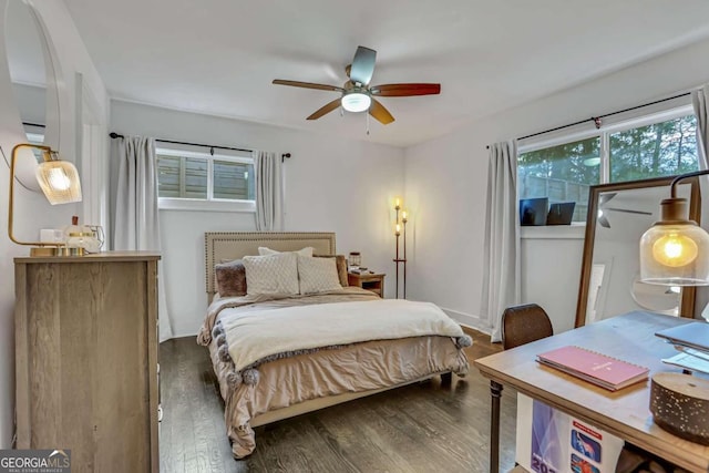 bedroom featuring ceiling fan and dark wood-type flooring