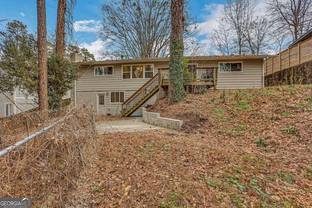 rear view of house with a deck