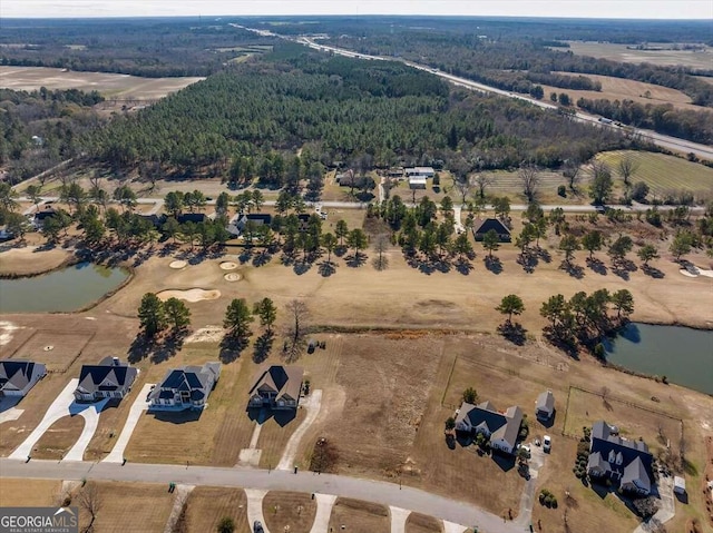 bird's eye view with a water view and a rural view