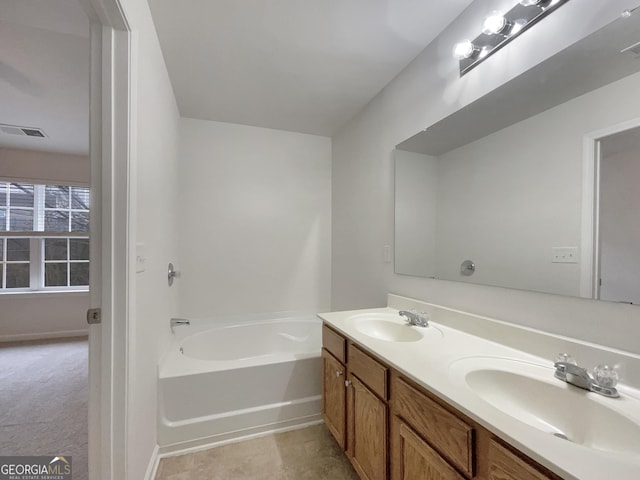 bathroom with vanity and a bathing tub