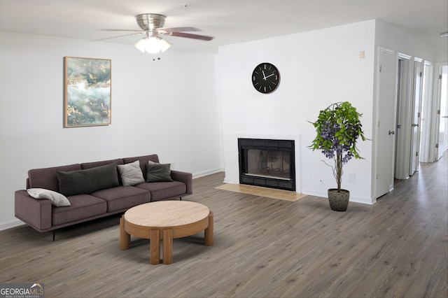 living room with hardwood / wood-style flooring and ceiling fan