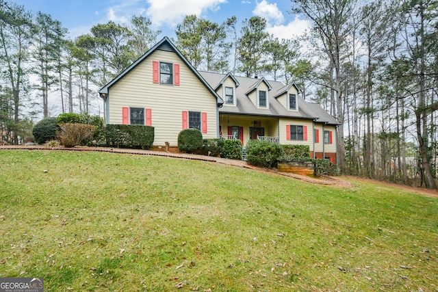 cape cod-style house with covered porch and a front lawn