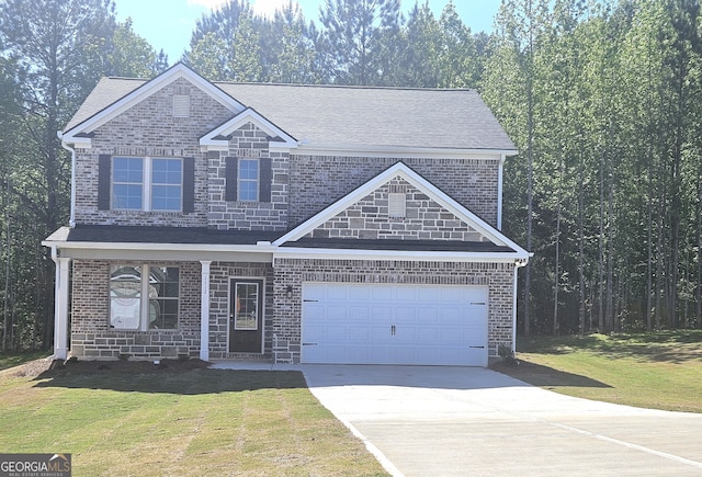 view of front of home featuring a front yard and a garage