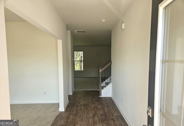 hallway featuring dark wood-type flooring