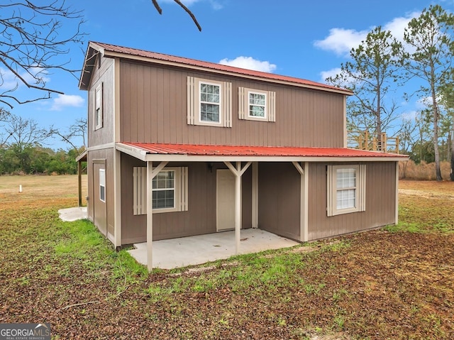 rear view of property featuring a patio