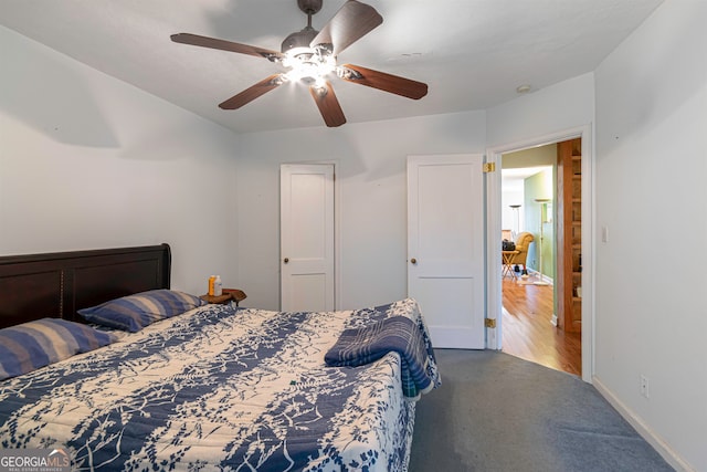 carpeted bedroom with ceiling fan