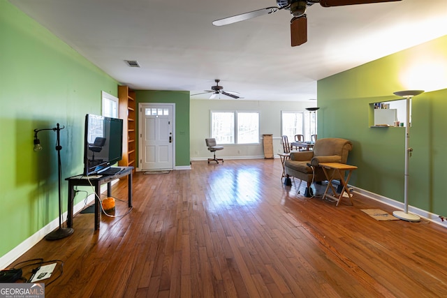 interior space featuring ceiling fan and wood-type flooring