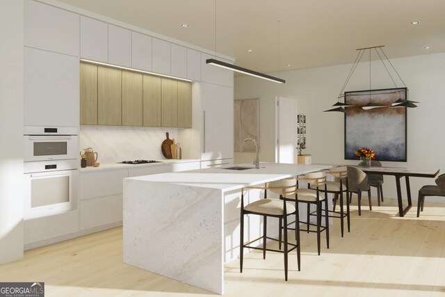 318 Sandy Springs Cir Unit 160, Sandy Springs, GA 30328 - kitchen featuring a sink, modern cabinets, light wood finished floors, white appliances, and recessed lighting