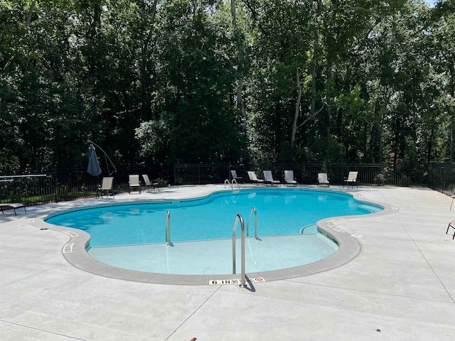 view of swimming pool featuring a patio