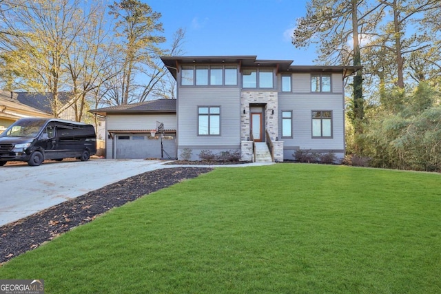 view of front of house with a front lawn and a garage