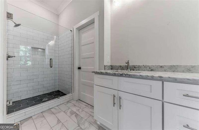 bathroom featuring walk in shower, tile flooring, and vanity