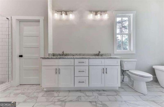 bathroom featuring toilet, tile flooring, and double vanity