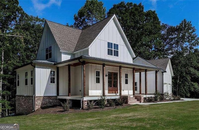 modern inspired farmhouse with a porch and a front yard