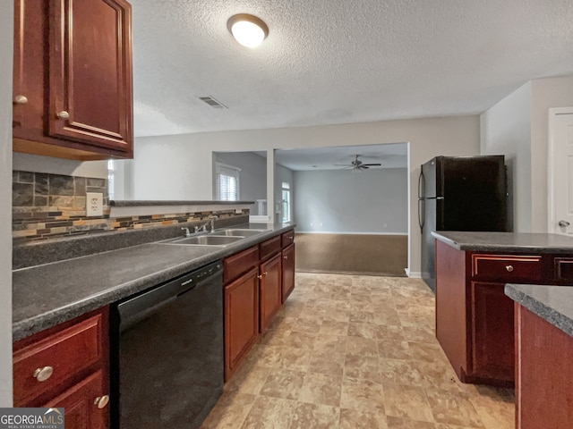 kitchen with black dishwasher, sink, a textured ceiling, ceiling fan, and decorative backsplash