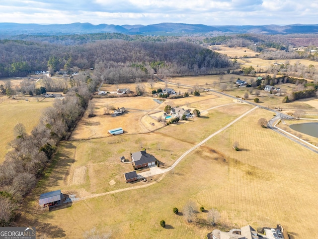 birds eye view of property featuring a rural view and a mountain view