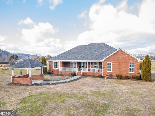 ranch-style house with covered porch, a gazebo, and a front yard