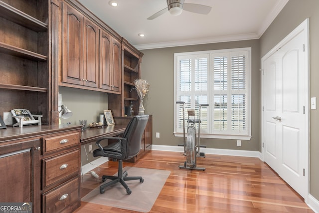 office space with ornamental molding, ceiling fan, and light wood-type flooring