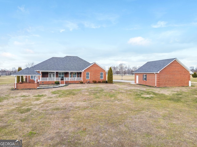 exterior space with a porch and a front lawn