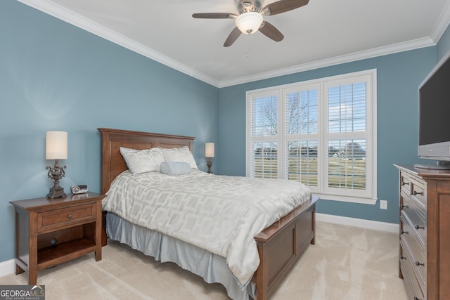 carpeted bedroom featuring ceiling fan and ornamental molding