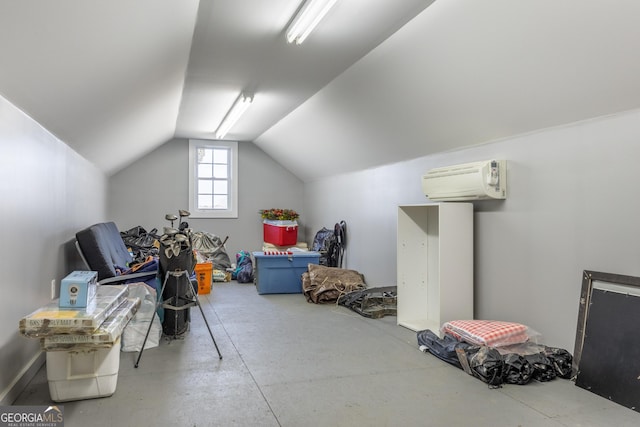 additional living space featuring lofted ceiling and an AC wall unit