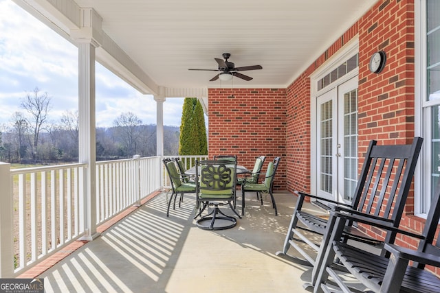 sunroom with ceiling fan and french doors