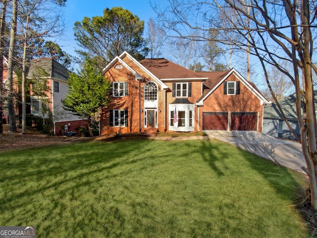 view of front of property featuring a garage and a front lawn