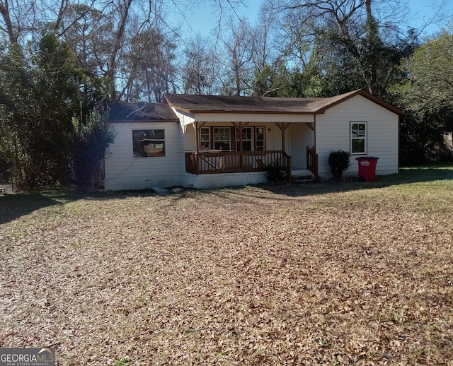 ranch-style house with a front lawn